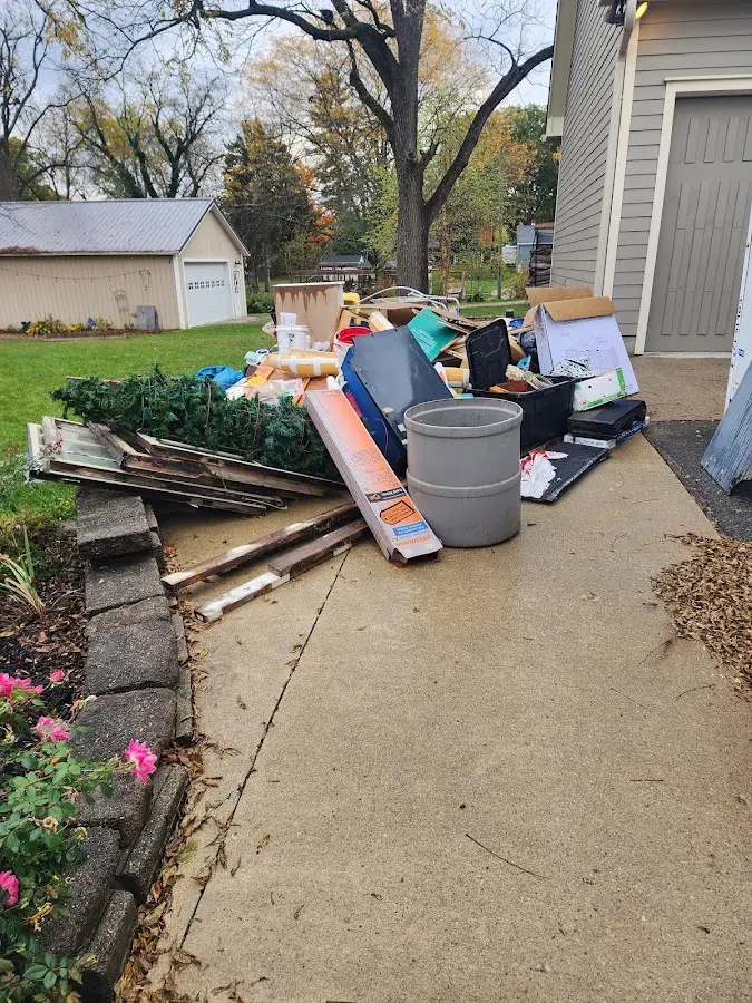 Dumpster being loaded with debris for Residential Dumpster Rental in Hesperia